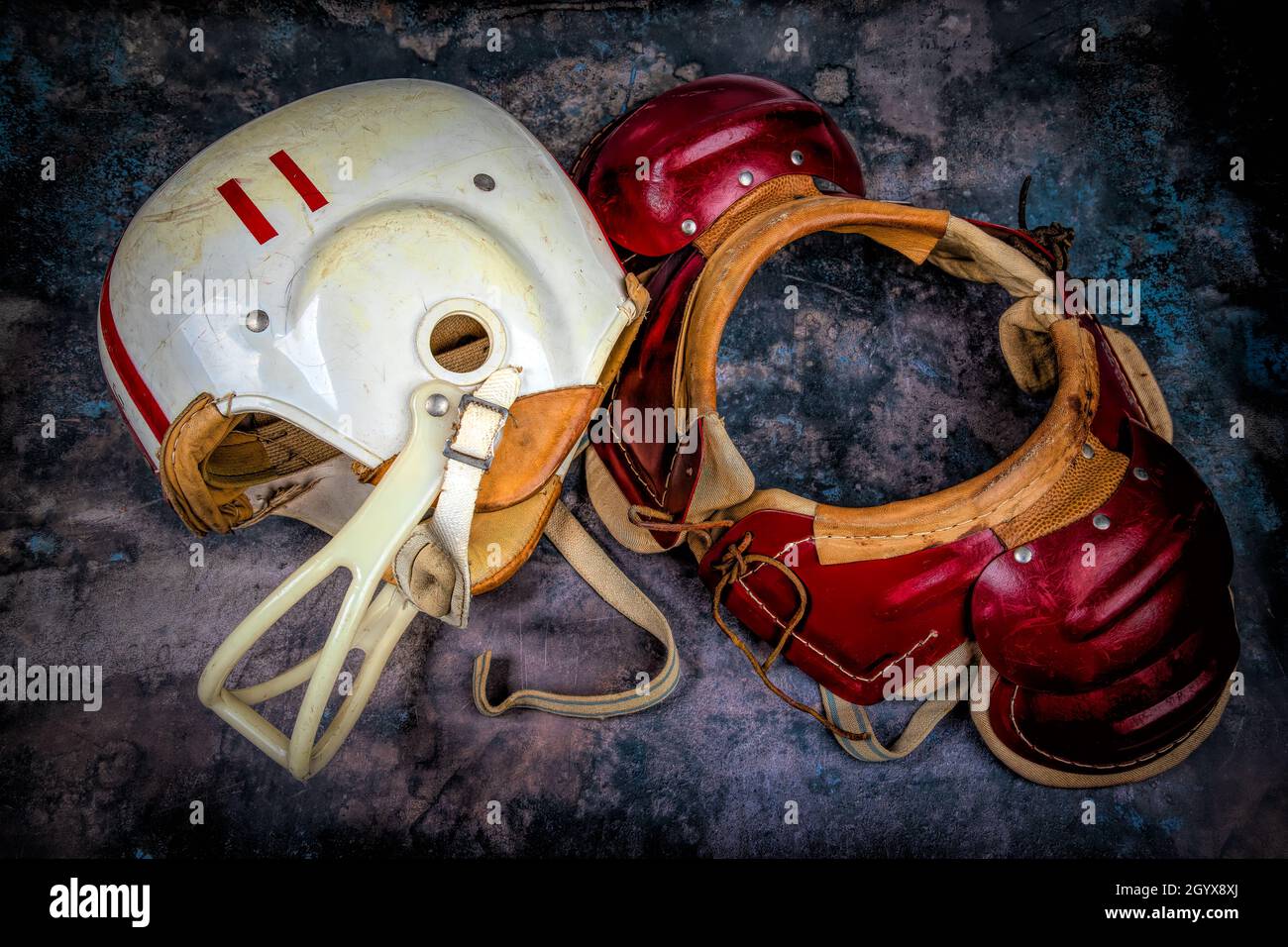 Vintage Boys Football Helmets and Leather Shoulder Pads Stock Photo Alamy