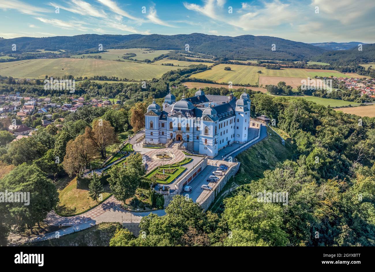 Aerial view of Halic castle in Slovakia, mansion turned luxury five star hotel with manicured garden brick driveway with pattern Stock Photo
