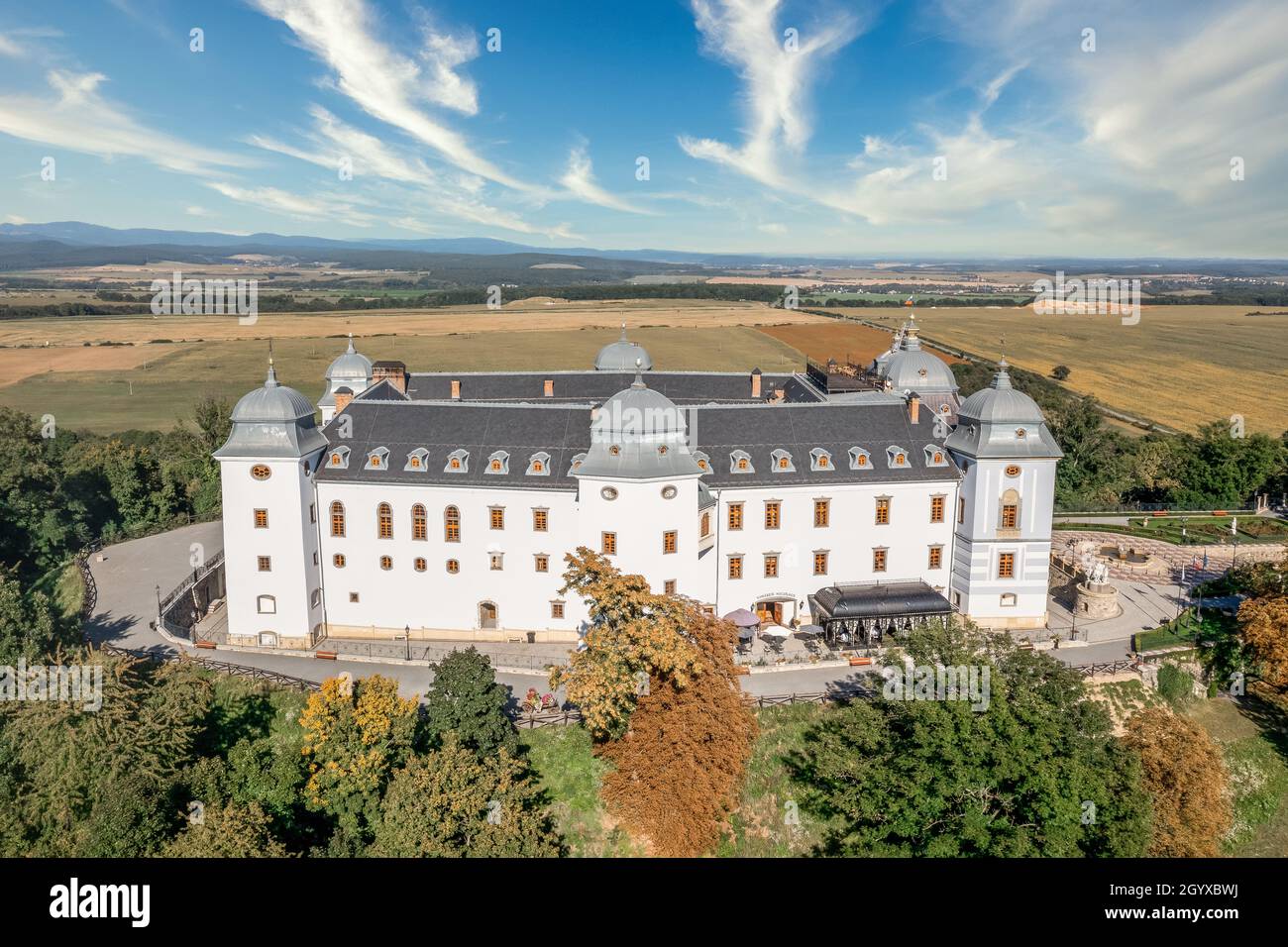 Aerial view of Halic castle in Slovakia, mansion turned luxury five star hotel with manicured garden brick driveway with pattern Stock Photo
