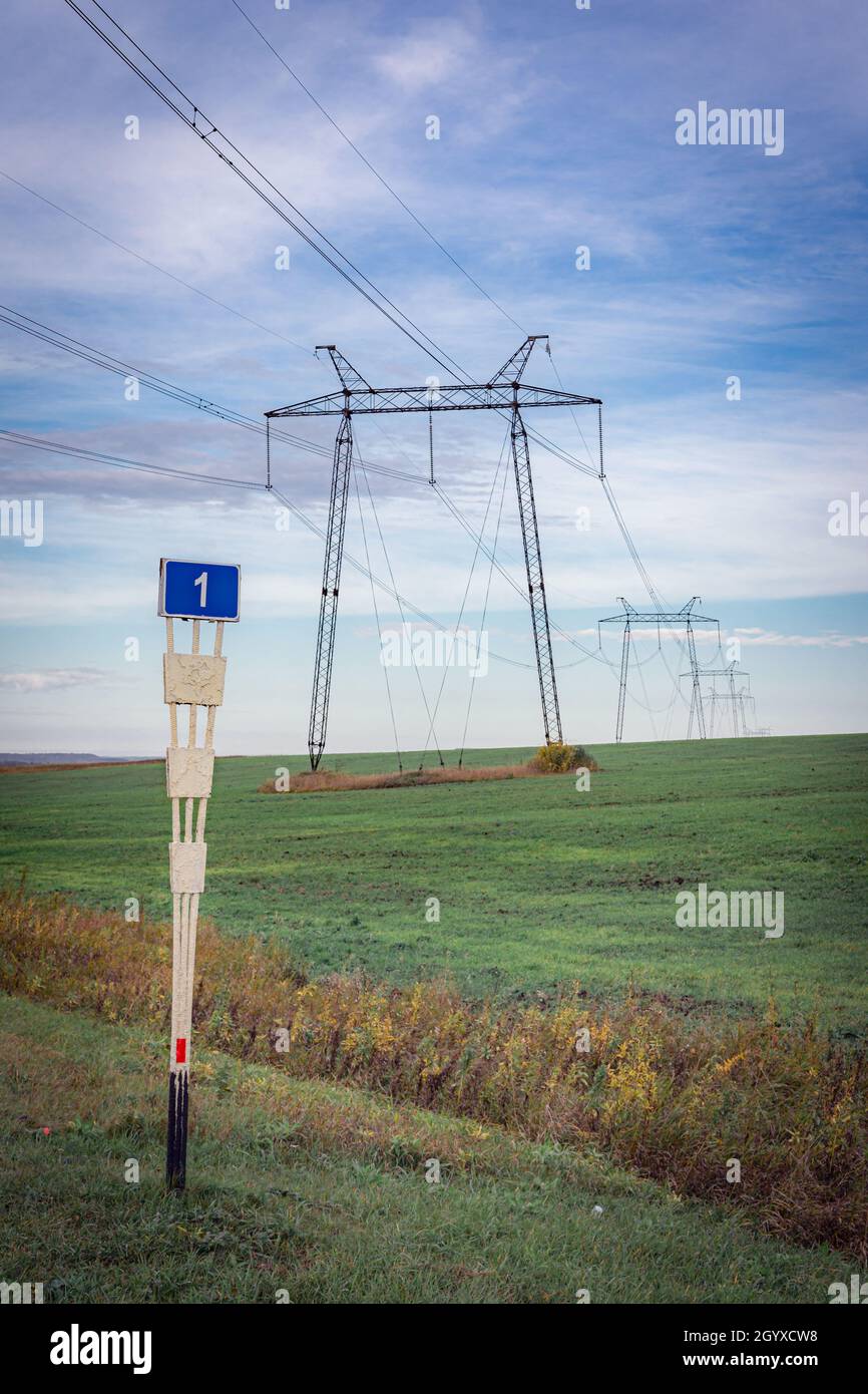 power lines on the evening sky background Stock Photo - Alamy
