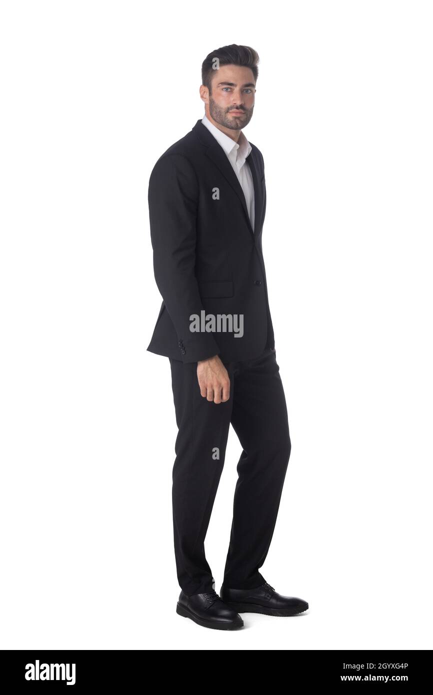 Full length portrait of young handsome business man in black suit ...