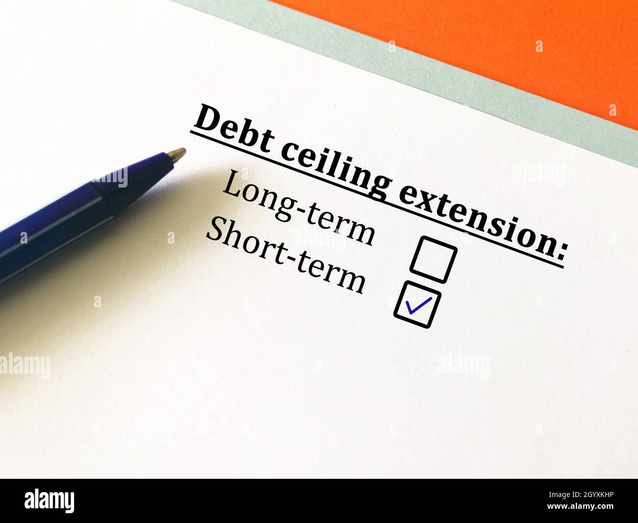 One person is answering question about economy. The person chooses short term debt ceiling extension. Stock Photo