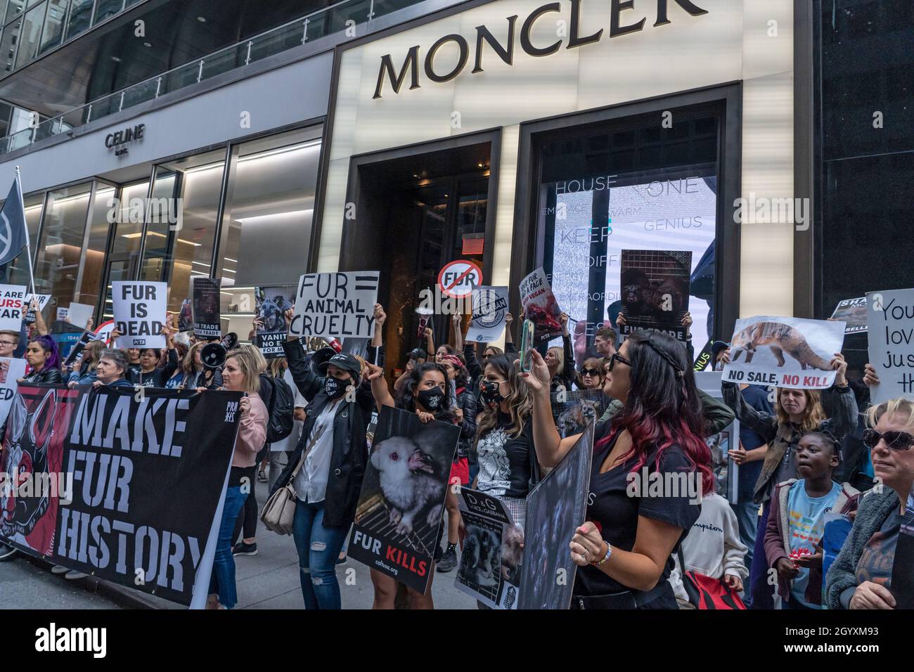 NEW YORK, NY - OCTOBER 9: Animal rights activists protest with signs and  banners in front of the Moncler store on Madison Avenue on October 9, 2021  in New York City. Animal