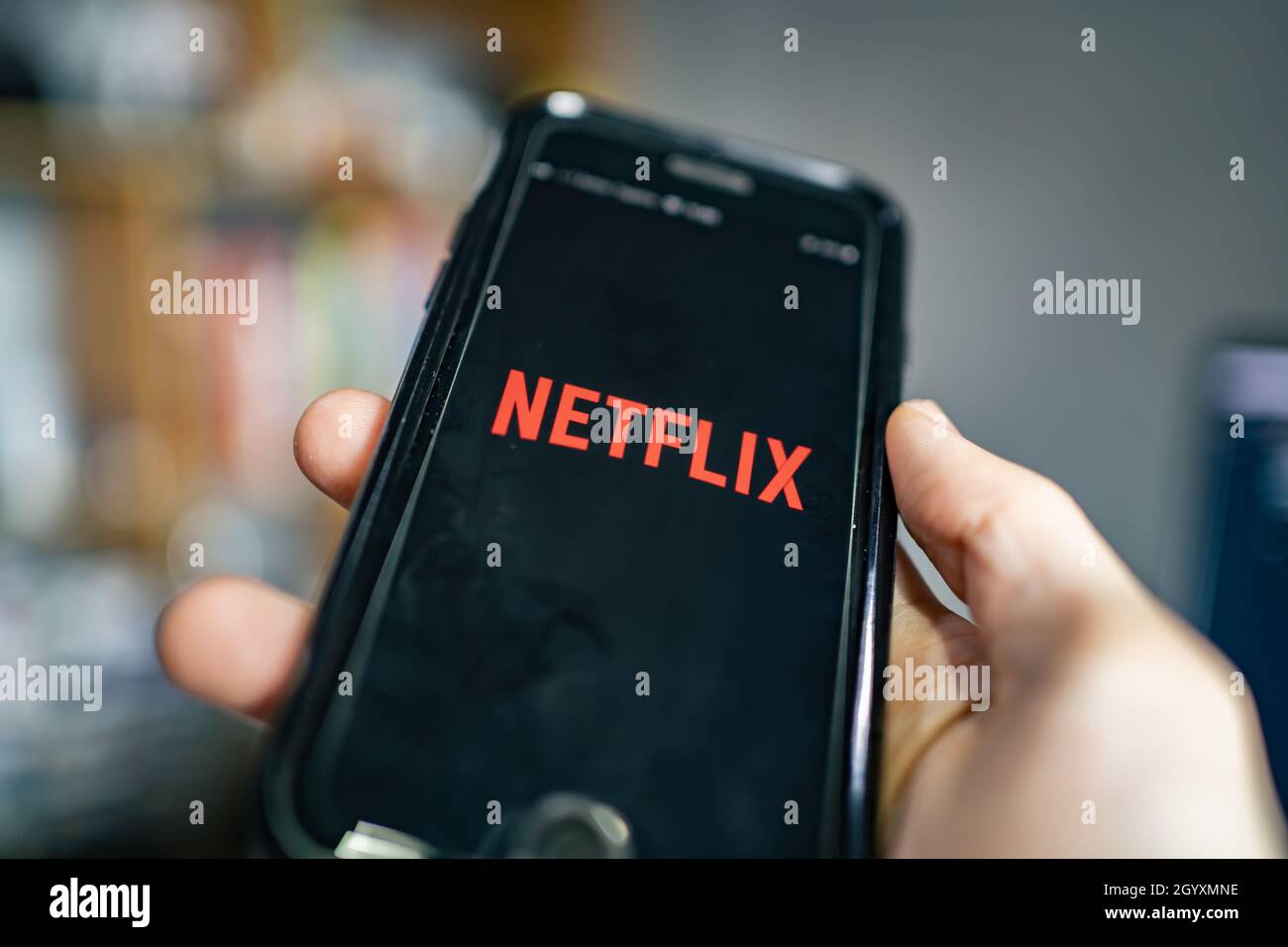 Bangkok, Thailand - October 4, 2021: iPhone 7 showing its screen with Netflix application. Stock Photo