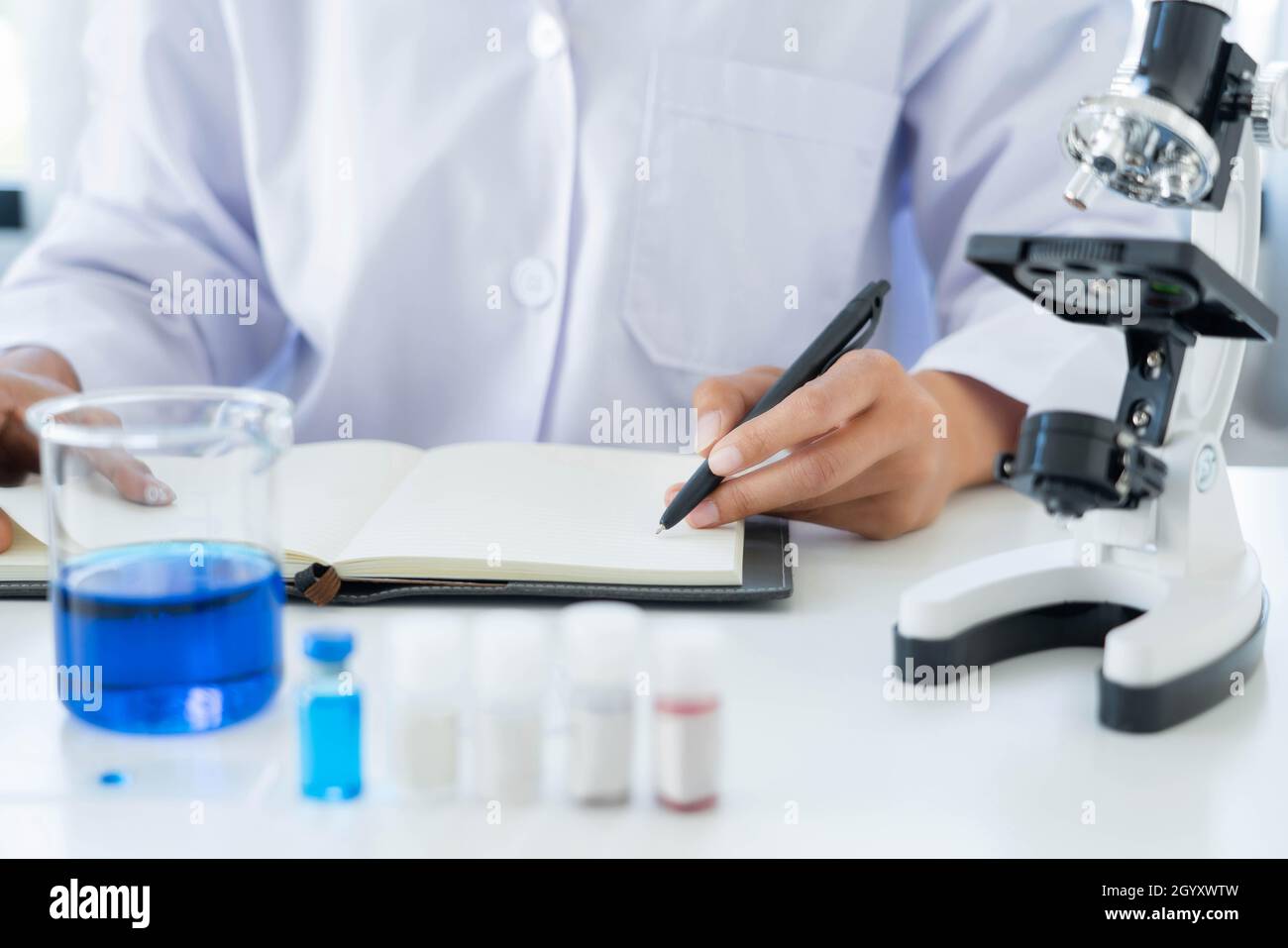 Scientist wear lab coat and protective wear are working with research or doing investigations