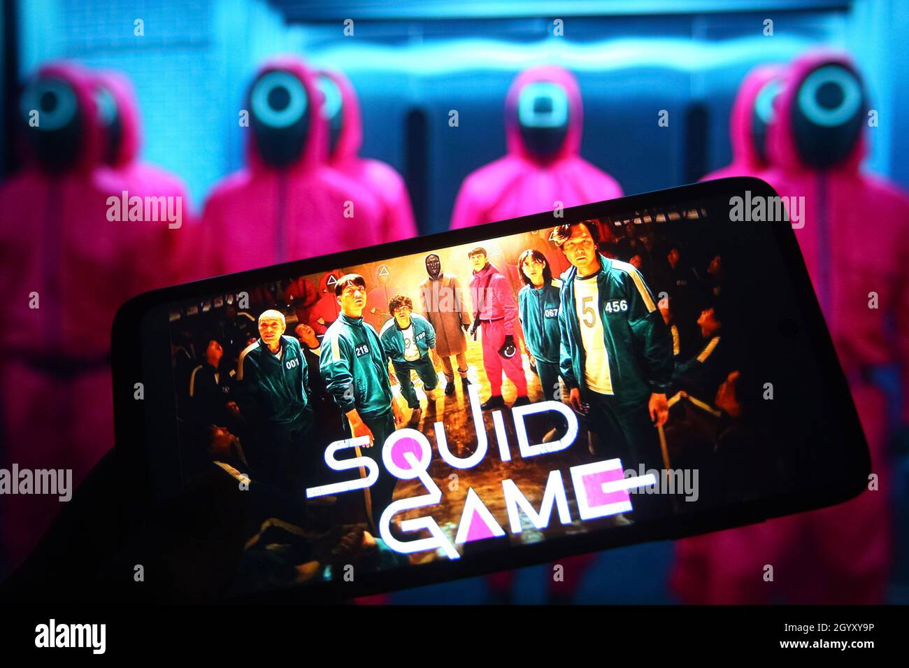 In this photo illustration a Squid Game television series logo streaming on Netflix is seen on a smartphone. Stock Photo