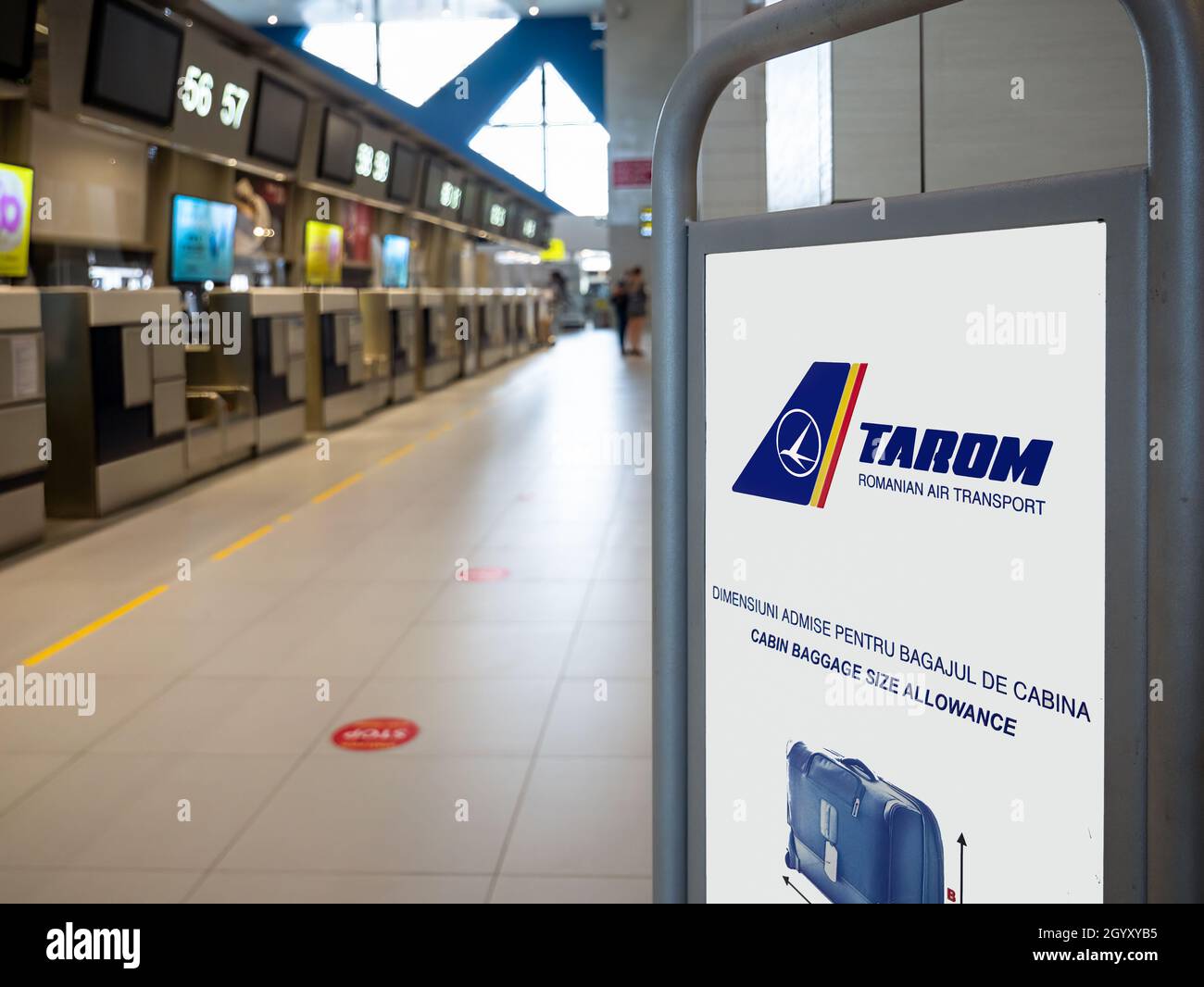 Bucharest, Romania - 08.28.2021: Tarom baggage allowance sign at check in  counters in Henry Coanda International Airport (Otopeni Stock Photo - Alamy