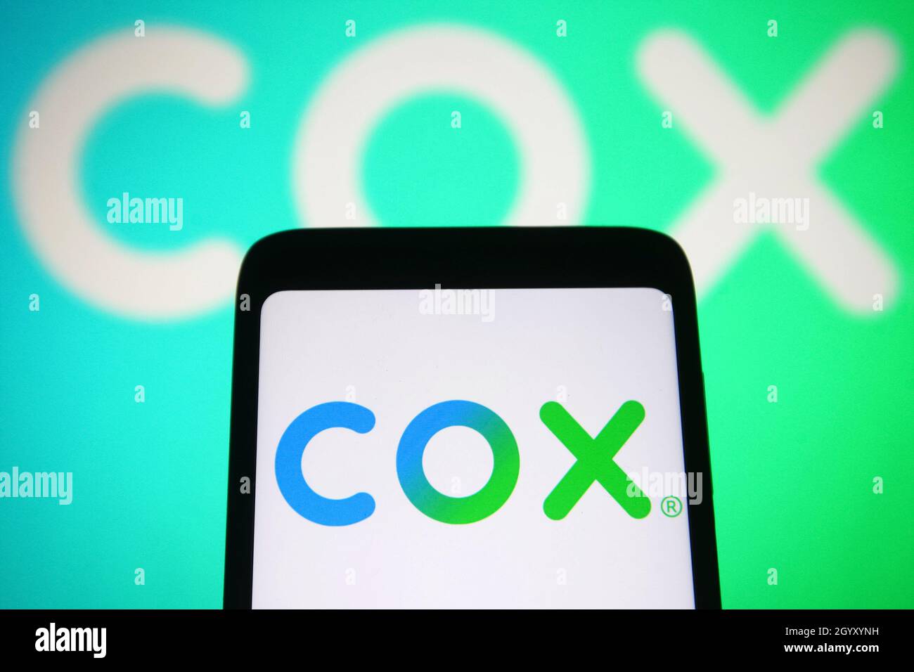 In this photo illustration a Cox Communications, Inc. (Cox Cable) logo ...