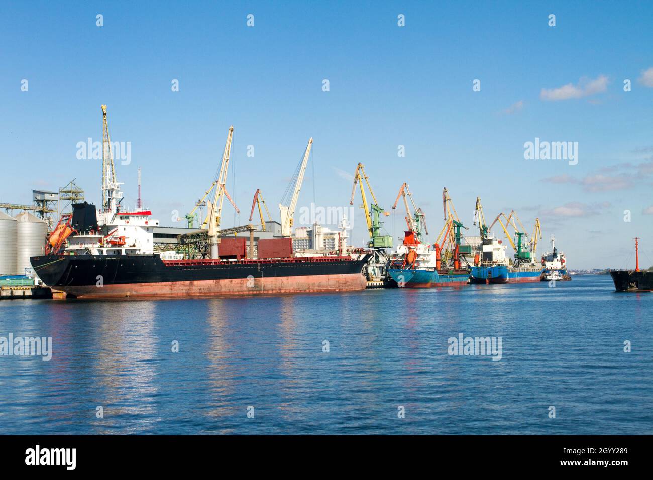 image of sea ships loading tower cranes in port Stock Photo