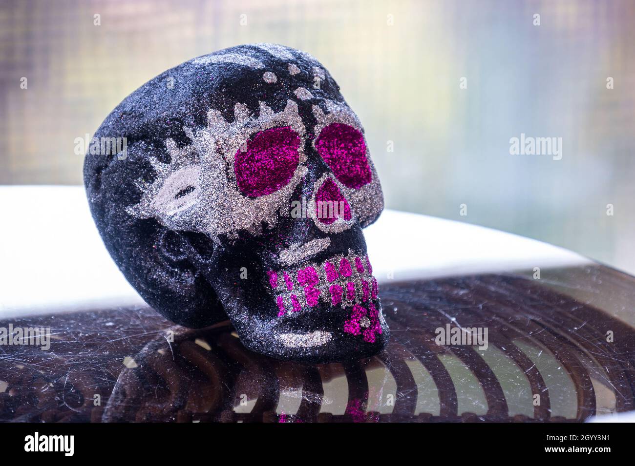 mexican pink or purple skull Day of the Dead calavera sugar skull background Stock Photo