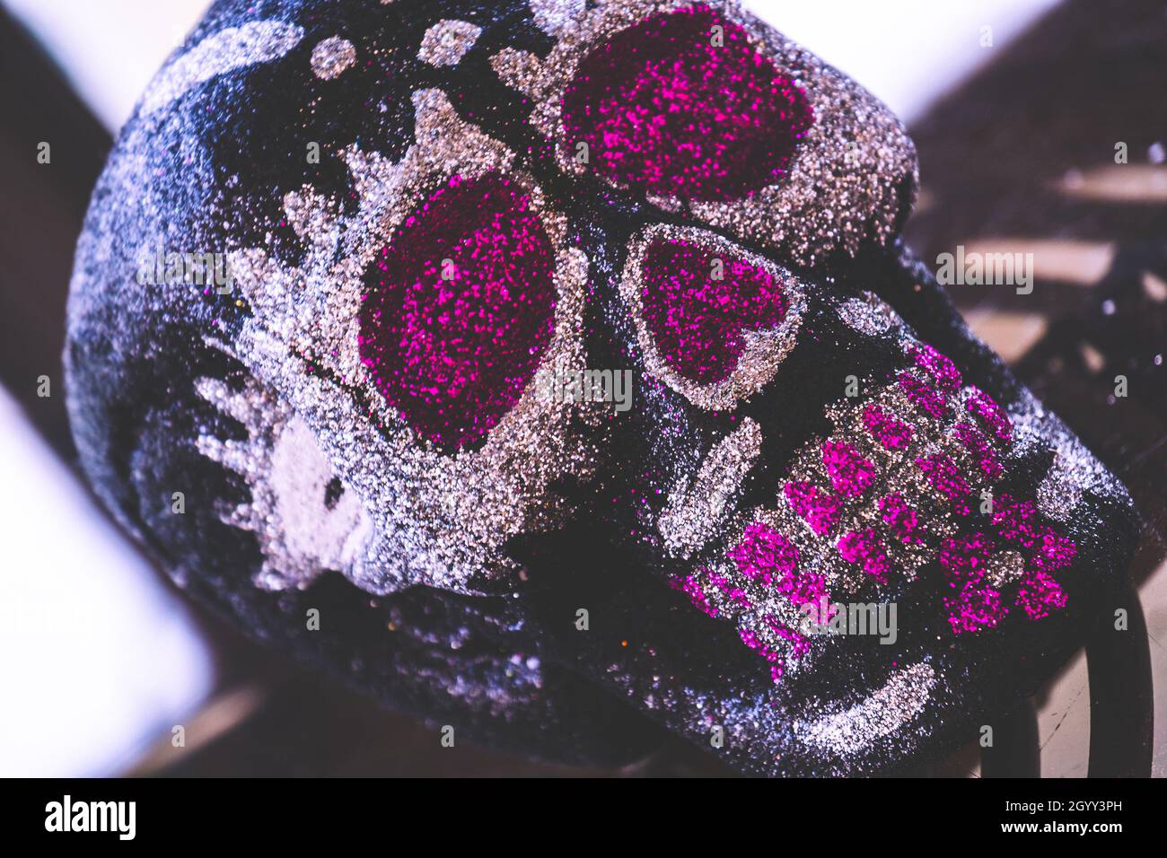 mexican pink or purple skull Day of the Dead calavera sugar skull background Stock Photo