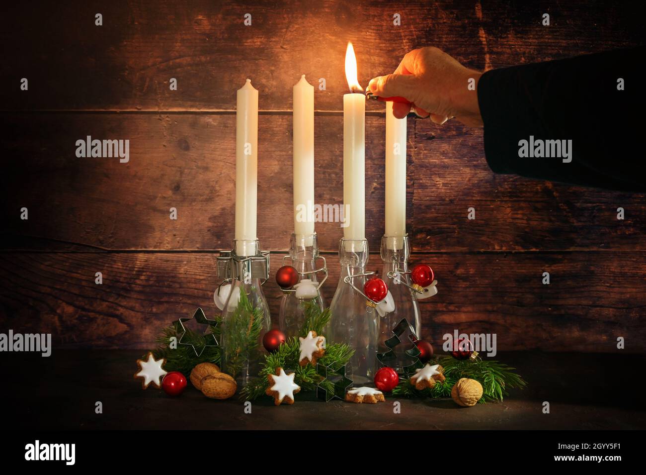 Lighting advent candle hires stock photography and images Alamy