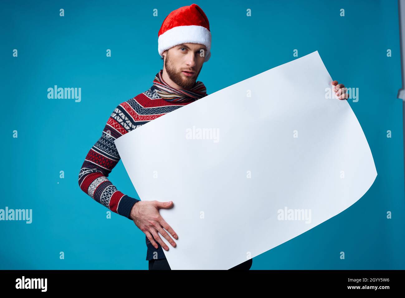 handsome man in a santa hat holding a banner holiday isolated ...