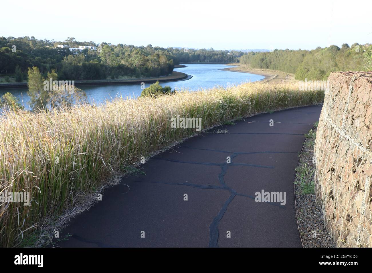 The path that goes around Haslam’s Marker with a view towards Haslams Creek, Sydney Olympic Park Stock Photo