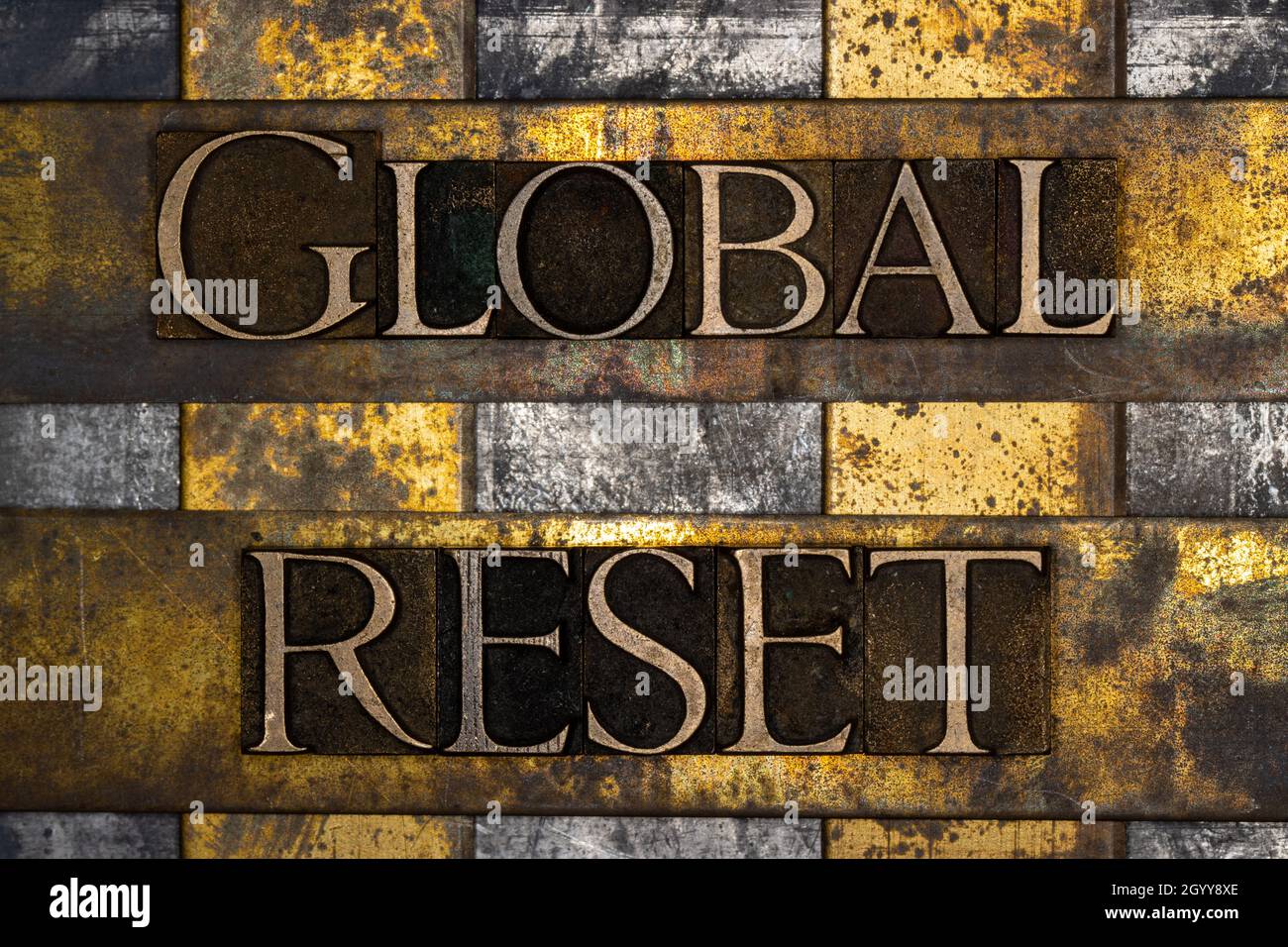 Global Reset text on textured grunge copper and vintage gold background Stock Photo