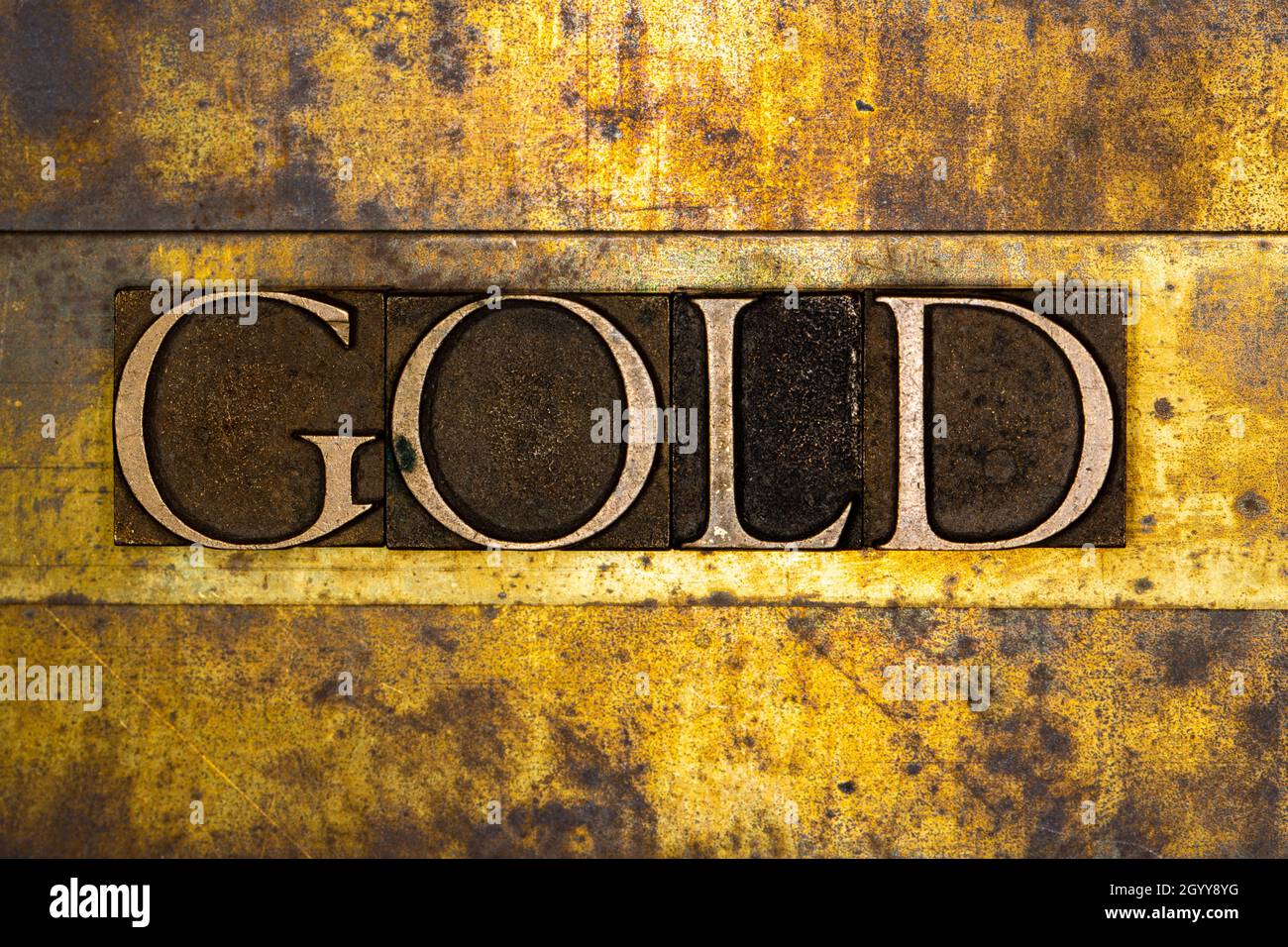 Gold text on textured grunge copper and vintage gold background Stock Photo