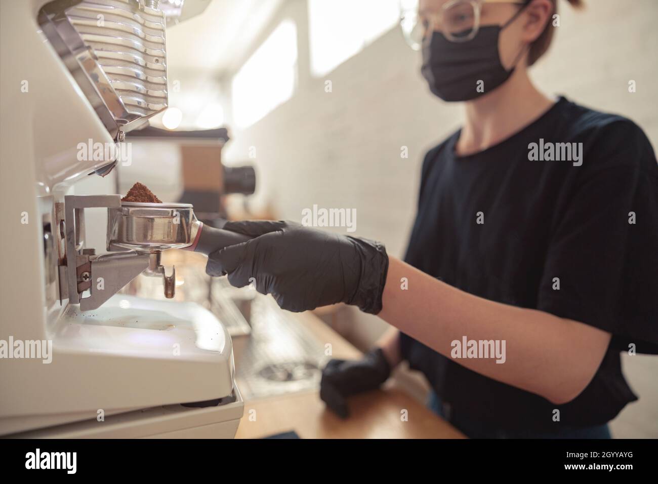 Woman using coffee machine hi-res stock photography and images - Alamy