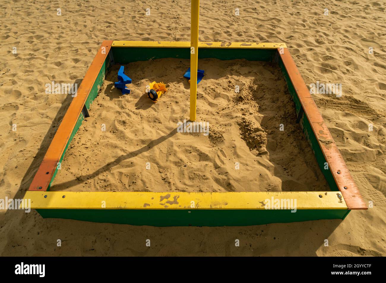 sandbox on the playground with broken toys Stock Photo Alamy