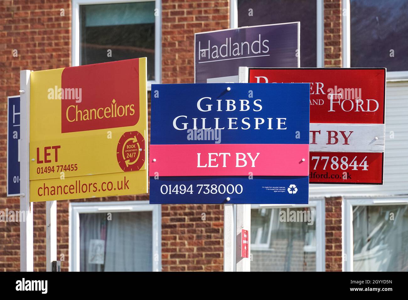 Real estate signs To Let outside terraced houses in Chesham