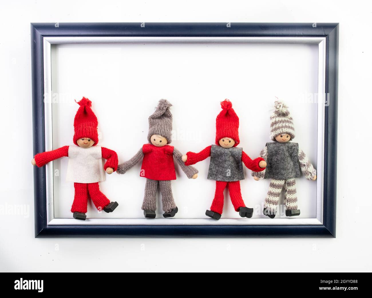 Funny christmas dwarfs in image frame on white background Stock Photo