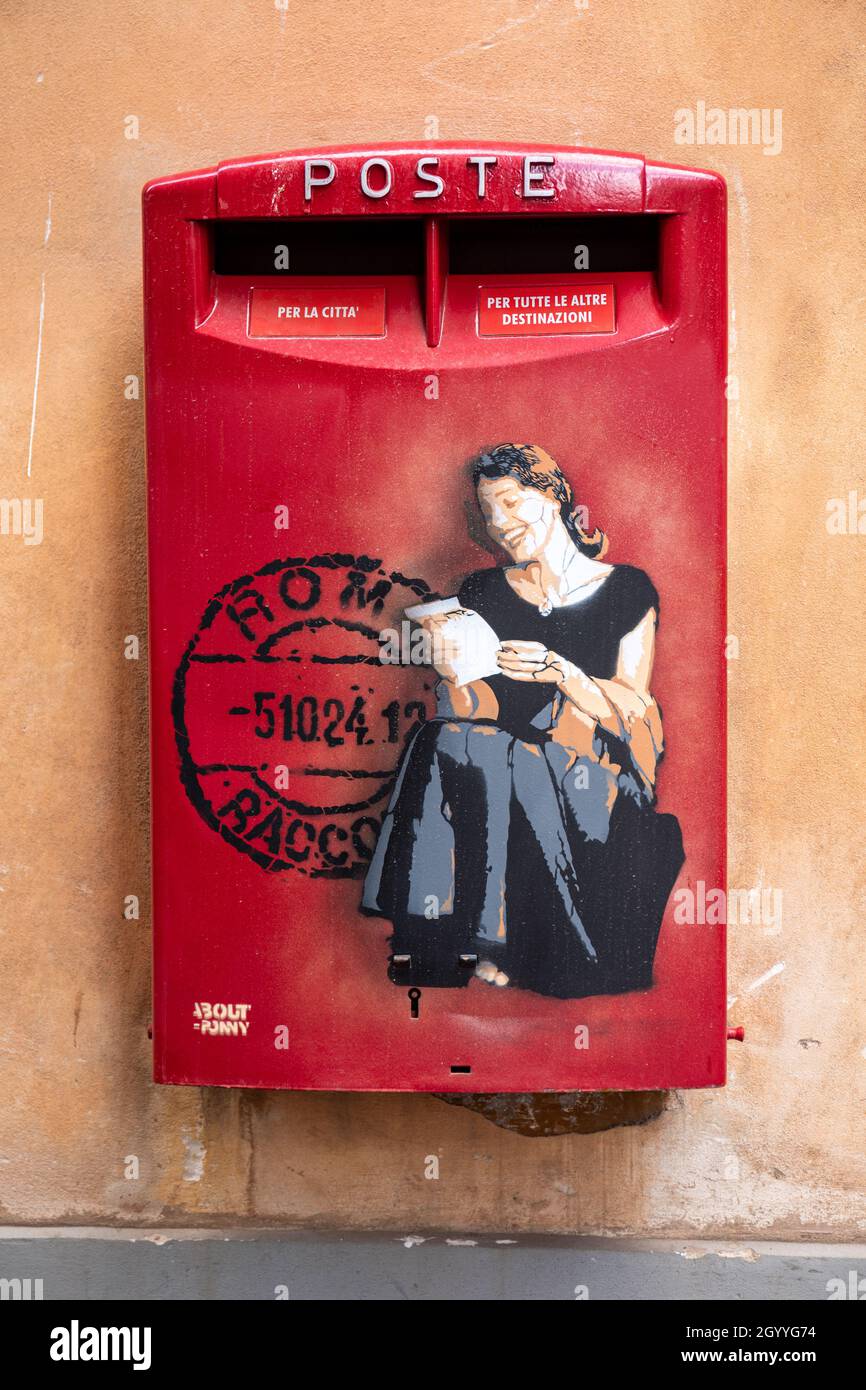 Poste Italiane letterbox with image of a woman reading a letter and postmark in Rome, Italy Stock Photo