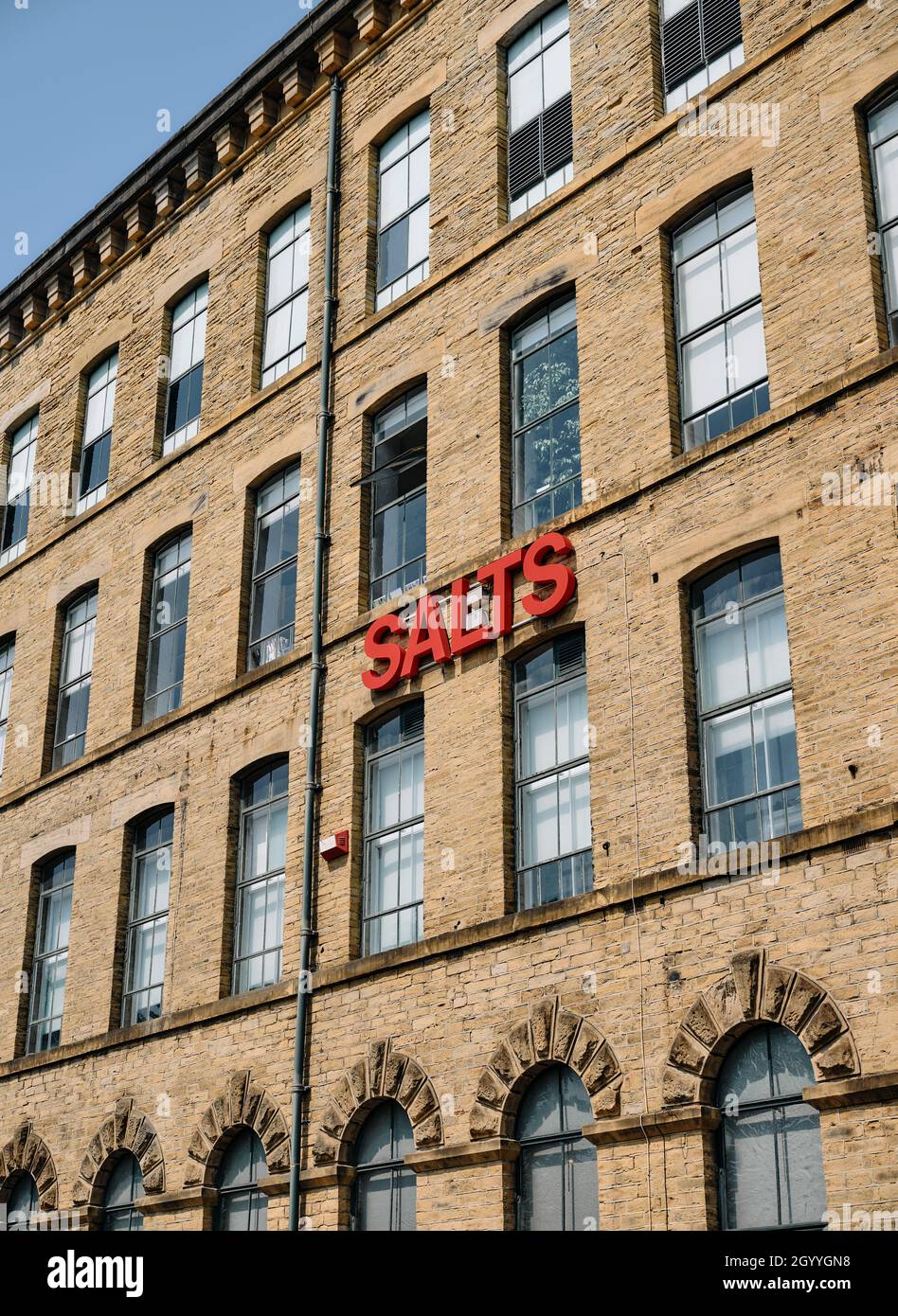 Salts Mill Saltsaire facade former textile mill art gallery, shopping centre and restaurant complex in Saltaire, Bradford, West Yorkshire, England UK Stock Photo