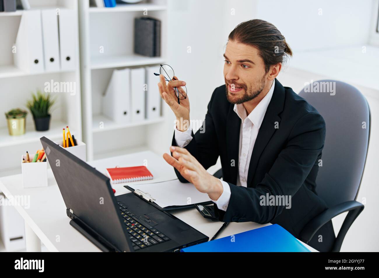 manager work in the office in front of a laptop technologies Stock ...