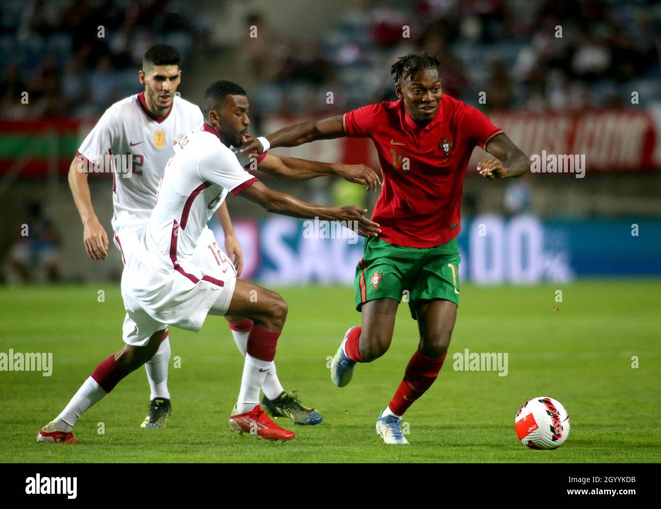 FARO, PORTUGAL - OCTOBER 09: Rafael Leao of Portugal competes for the ball with Abdulaziz Hatem and Karim Boudiaf of Qatar ,during the international friendly match between Portugal and Qatar at Estadio Algarve on October 9, 2021 in Faro, Faro. (Photo by MB Media) Stock Photo