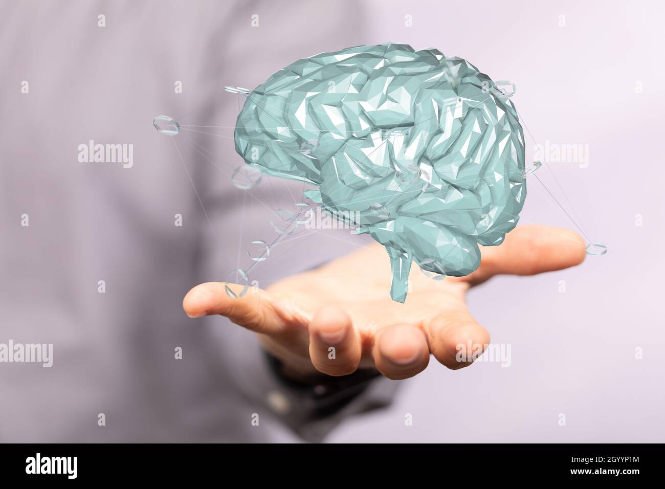 A floating 3D human brain icon above a hand - artificial intelligence ...