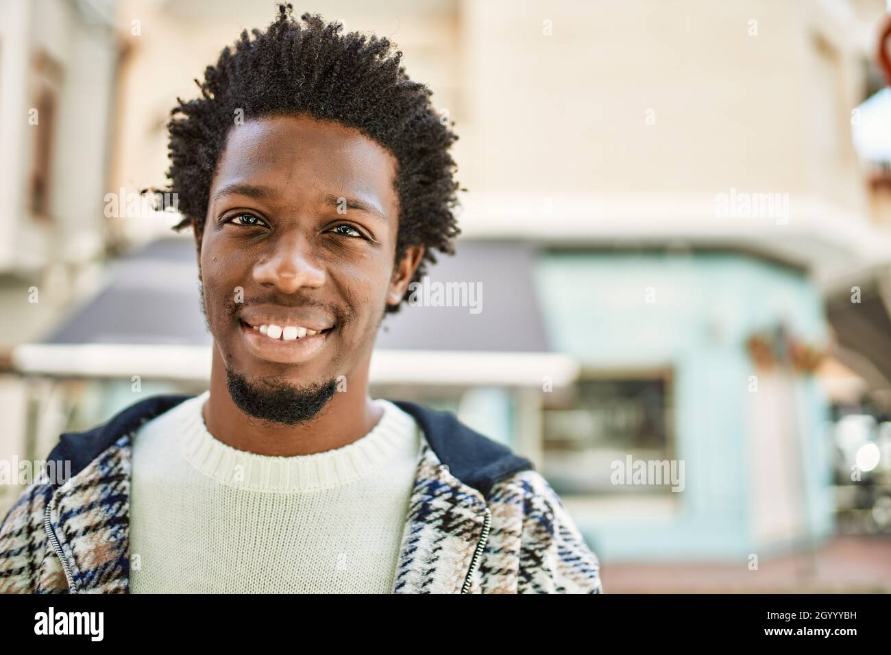 Handsome black man with afro hair and beard smiling happy outdoors Stock  Photo - Alamy