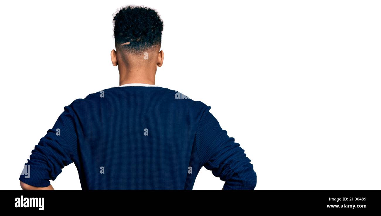 Young african american man wearing casual clothes standing backwards ...