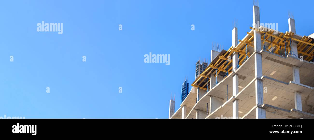 Banner residential construction site against blue sky background with copy space. Construction industry concept photo Stock Photo