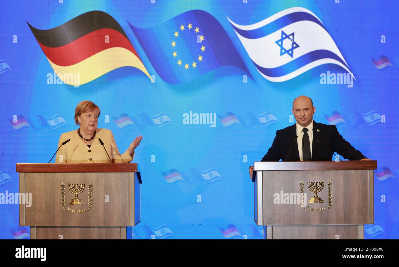 Jerusalem, Israel. 10th Oct, 2021. German Chancellor Angela Merkel and Israeli Prime Minister Naftali Bennett give a joint press conference following a cabinet meeting at the King David hotel in Jerusalem, Israel on Sunday, October 10, 2021. Germany's outgoing Chancellor said Israel's security will be a top priority for 'every German government' during a farewell tour in the Jewish state today, as she prepares to end a 16-year term in office. Pool Photo by Menahem Kahana/UPI Credit: UPI/Alamy Live News Stock Photo
