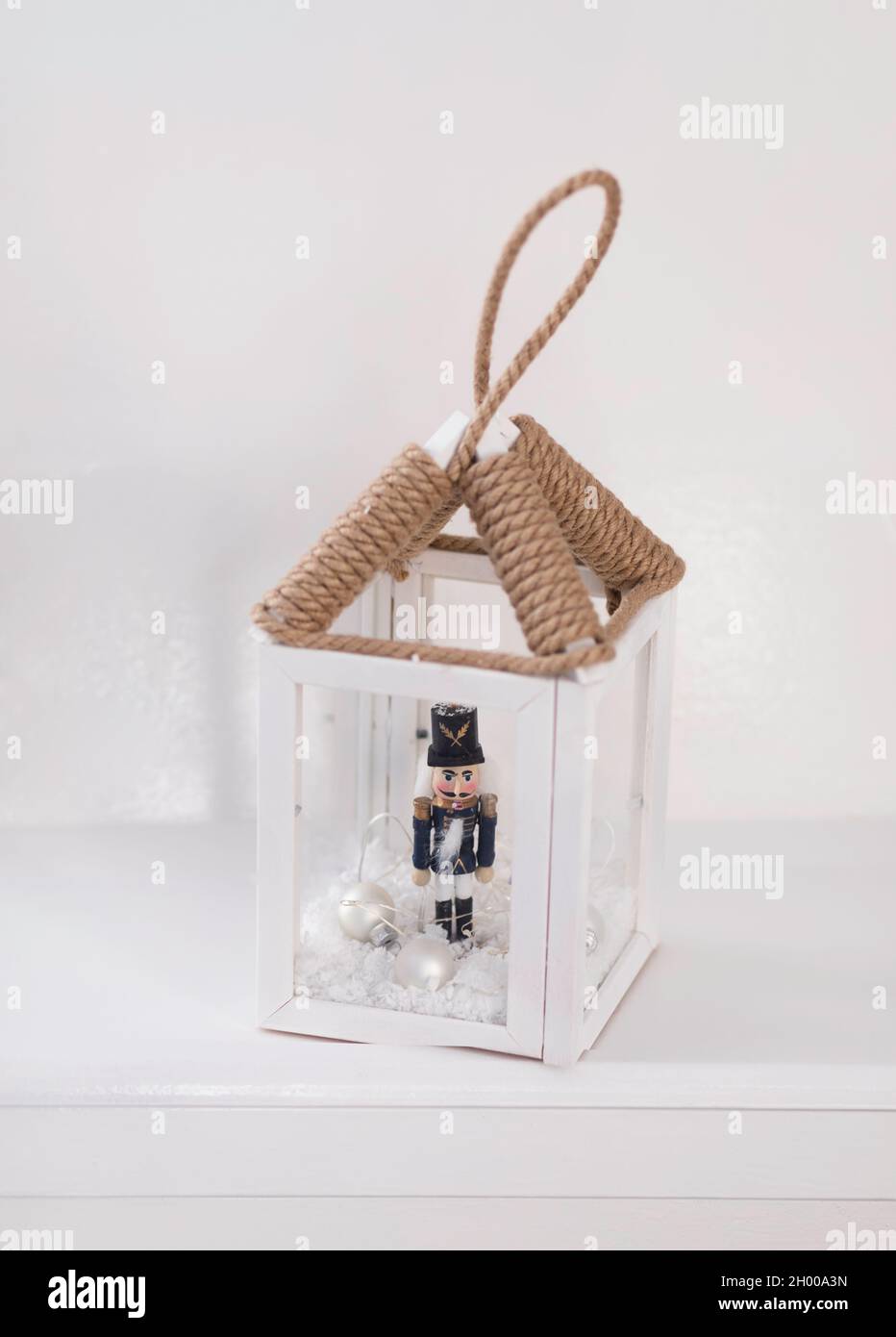 Christmas. A flashlight candlestick, vintage decorative, in a white interior Stock Photo