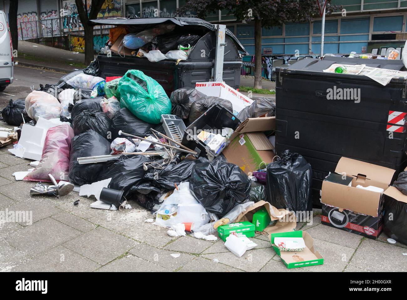 Overflowing rubbish bins in Brighton, East Sussex, UK Stock Photo