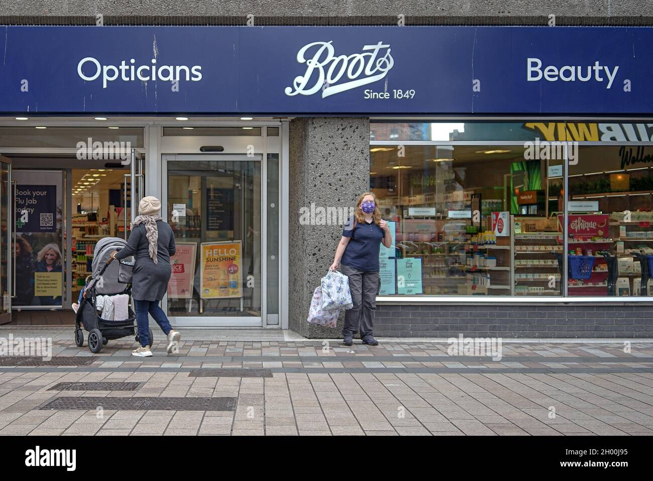 August 23, 2021, Belfast, United Kingdom: Masked pedestrians stand outside  Boots Pharmacy on Fountain Lane in Belfast. (Credit Image: © Michael  Mcnerney/SOPA Images via ZUMA Press Wire Stock Photo - Alamy