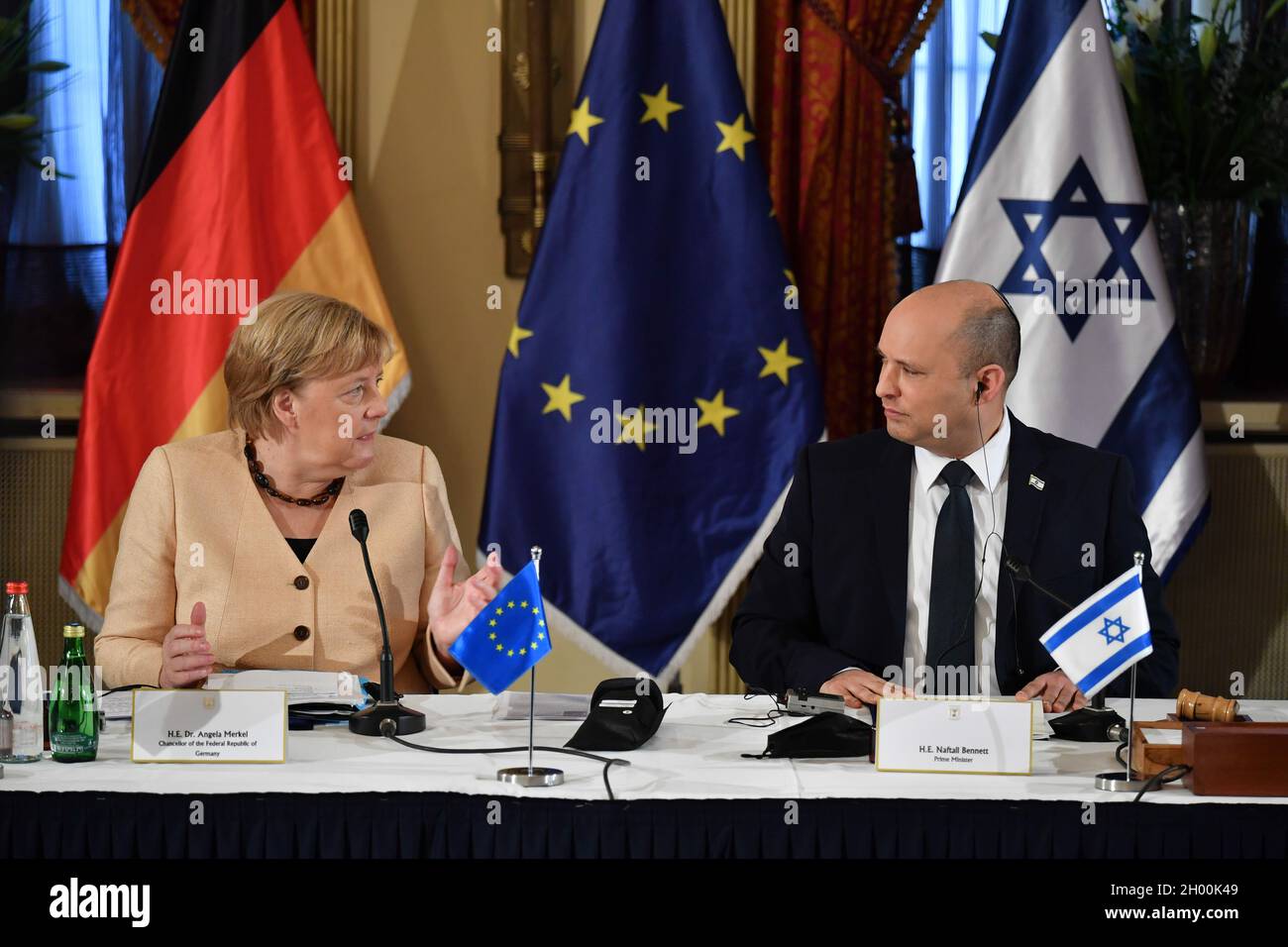 Jerusalem. 10th Oct, 2021. Israeli Prime Minister Naftali Bennett (R) meets with German Chancellor Angela Merkel at the King David Hotel in Jerusalem, Oct. 10, 2021. Germany's outgoing Chancellor Angela Merkel kick-started her visit to Israel on Sunday morning, marking her final official trip to the country before she leaves office. Credit: Yoav Dudkevitch/JINI via Xinhua/Alamy Live News Stock Photo