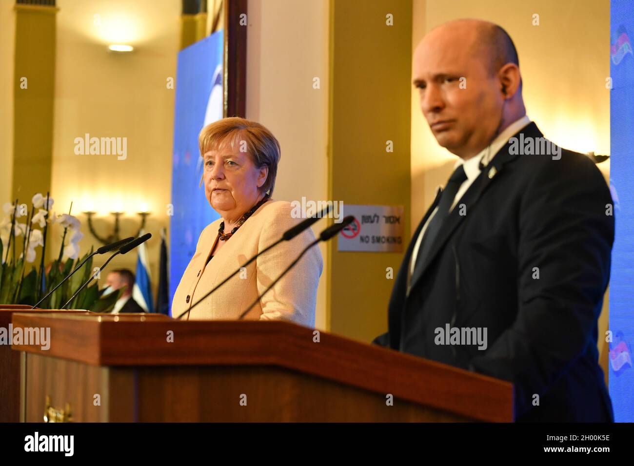 Jerusalem. 10th Oct, 2021. Israeli Prime Minister Naftali Bennett (R) and German Chancellor Angela Merkel attend a joint press conference at the King David Hotel in Jerusalem, Oct. 10, 2021. Germany's outgoing Chancellor Angela Merkel kick-started her visit to Israel on Sunday morning, marking her final official trip to the country before she leaves office. Credit: Yoav Dudkevitch/JINI via Xinhua/Alamy Live News Stock Photo