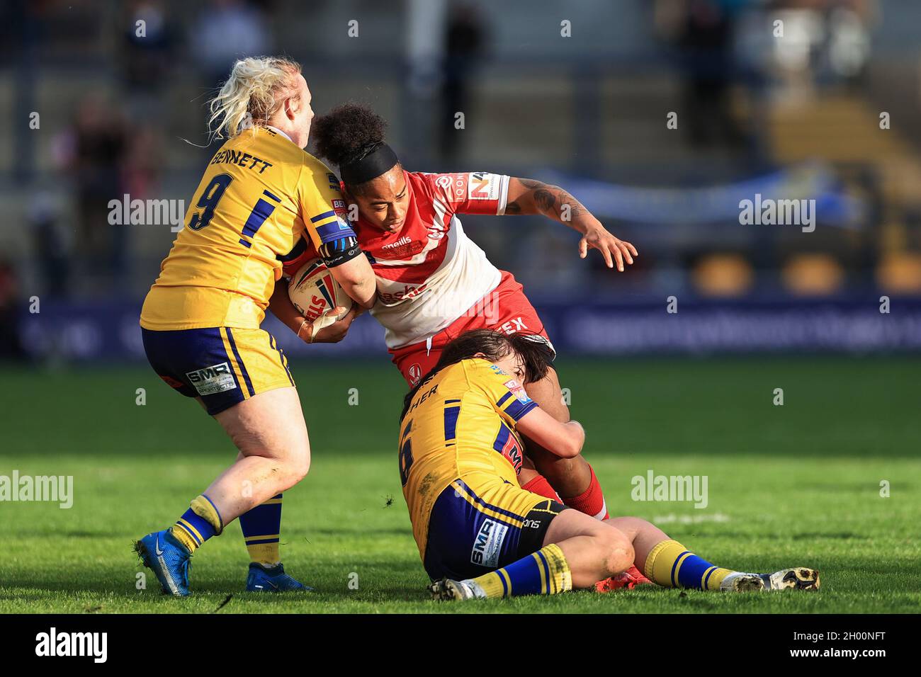 Leeds, UK. 10th Oct, 2021. Chantelle Crowl #13 of St Helens is tackled by Keara Bennett #9 of Leeds Rhinos and Hanna Butcher #6 of Leeds Rhinos in Leeds, United Kingdom on 10/10/2021. (Photo by Mark Cosgrove/News Images/Sipa USA) Credit: Sipa USA/Alamy Live News Stock Photo