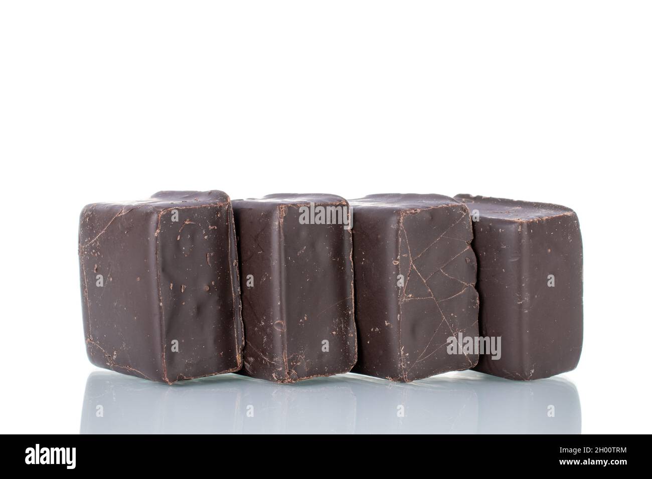 Several sweet chocolates, close-up, isolated on white. Stock Photo