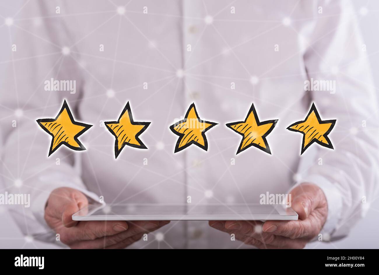 Quality concept above a tablet held by a man in background Stock Photo