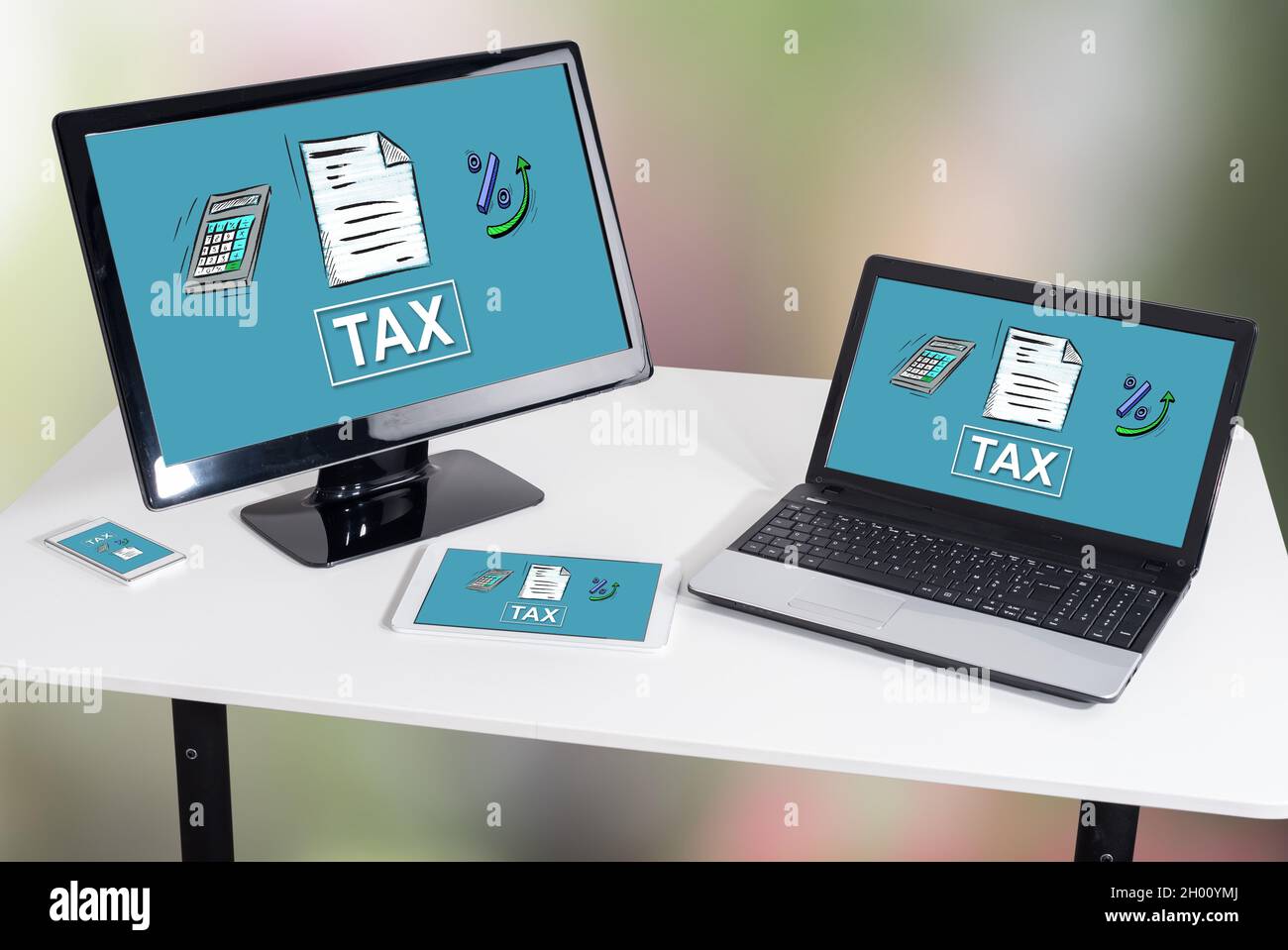 Tax concept shown on different information technology devices Stock ...