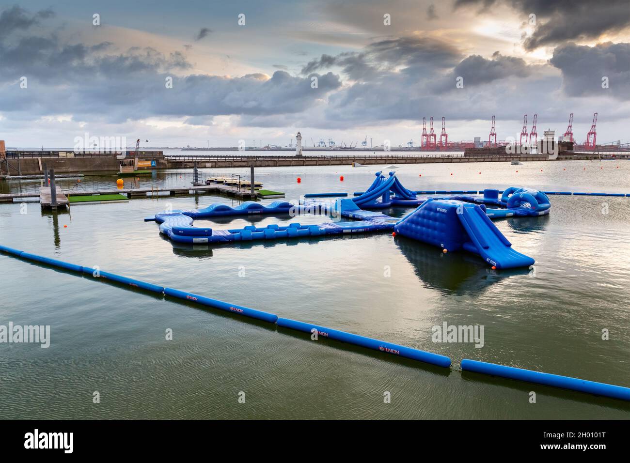 New Brighton, Wirral, UK: Wild Shore Aqua Park, sup self launch dock and obstacle course on the marine lake Stock Photo