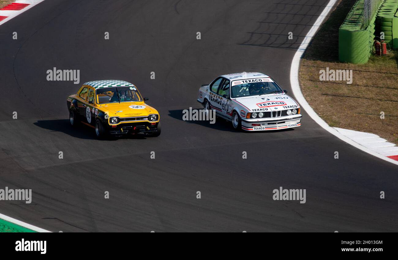 Italy, september 11 2021. Vallelunga classic. 70s vintage historic cars race on asphalt track overtaking, BMW 635 csi and Ford Escort RS 1600 Stock Photo