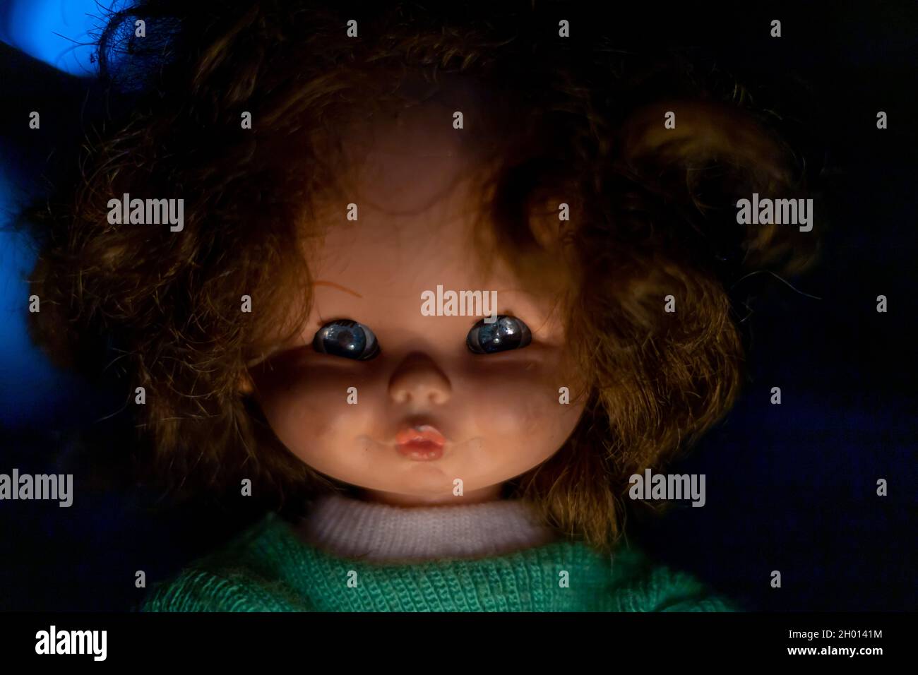 Close-up of an old doll head. Halloween concept Stock Photo