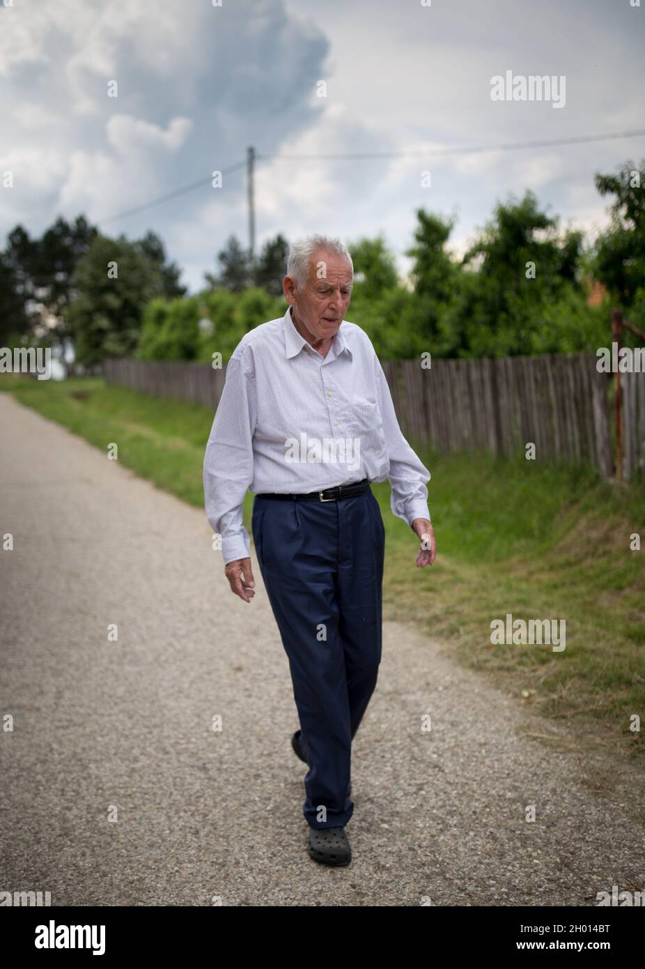 Man walking on country road hi-res stock photography and images - Alamy