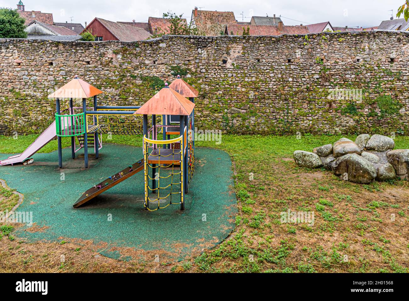 Children playground at the old city wall of Kientzheim, Kaysersberg, France Stock Photo