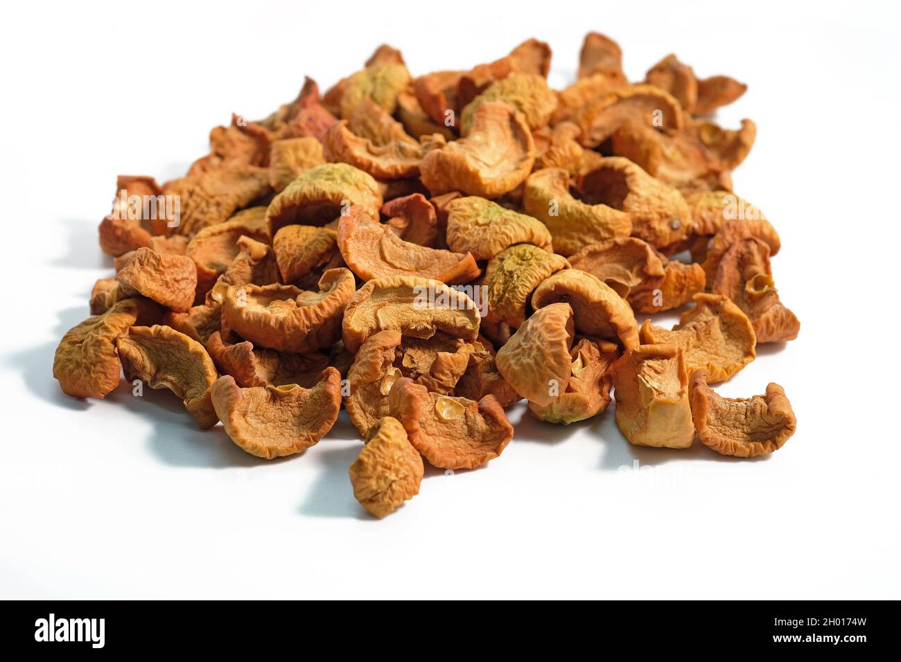 Dried pieces of apples on a white background. Dried apple fruits for