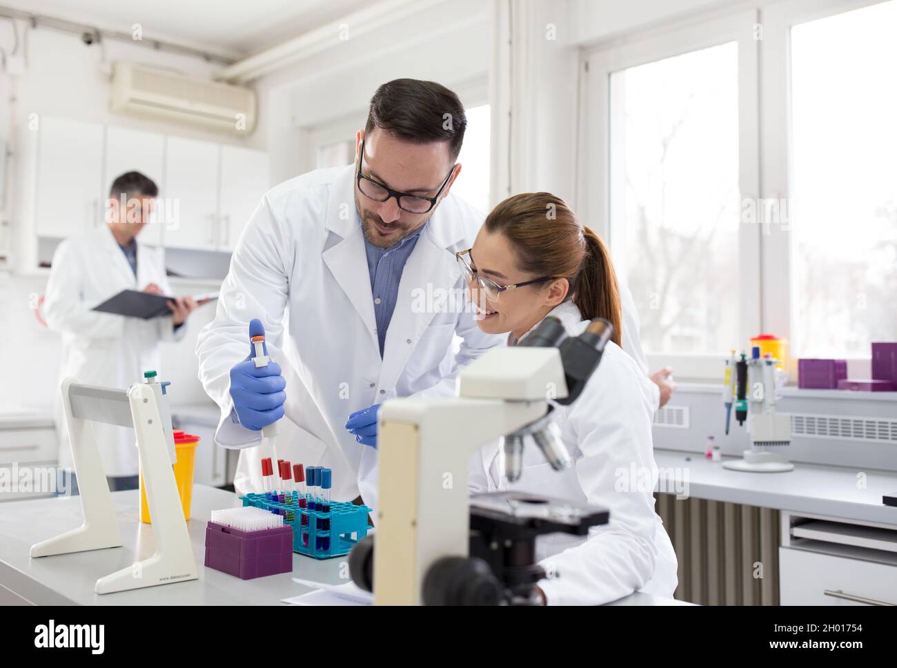 Biologist woman looking bacteria hi-res stock photography and images ...