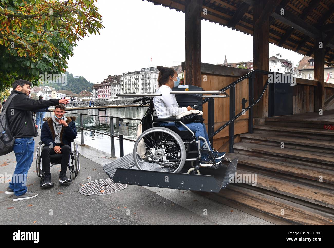 Wheelchair Access lift being used by young woman on Chapel Bridge